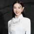Không còn cắt xẻ táo bạo, Hoa hậu Thùy Tiên quay trở lại với áo dài truyền thông khi đi sự kiện